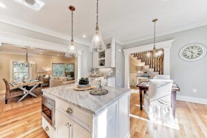 Image of the kitchen and dining area in a 2-story colonial style home in East Dennis, MA.