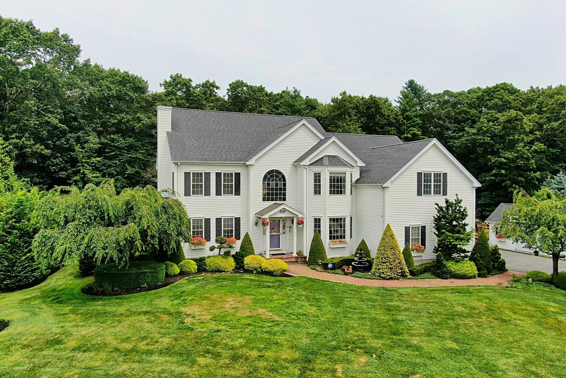 Image of a 2-story colonial home with great curb appeal showing how professional photos can boost your online or web appeal and attract more buyers