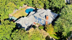 Aerial (drone) image of a 3-story colonial style home and property in North Attleborough, MA.